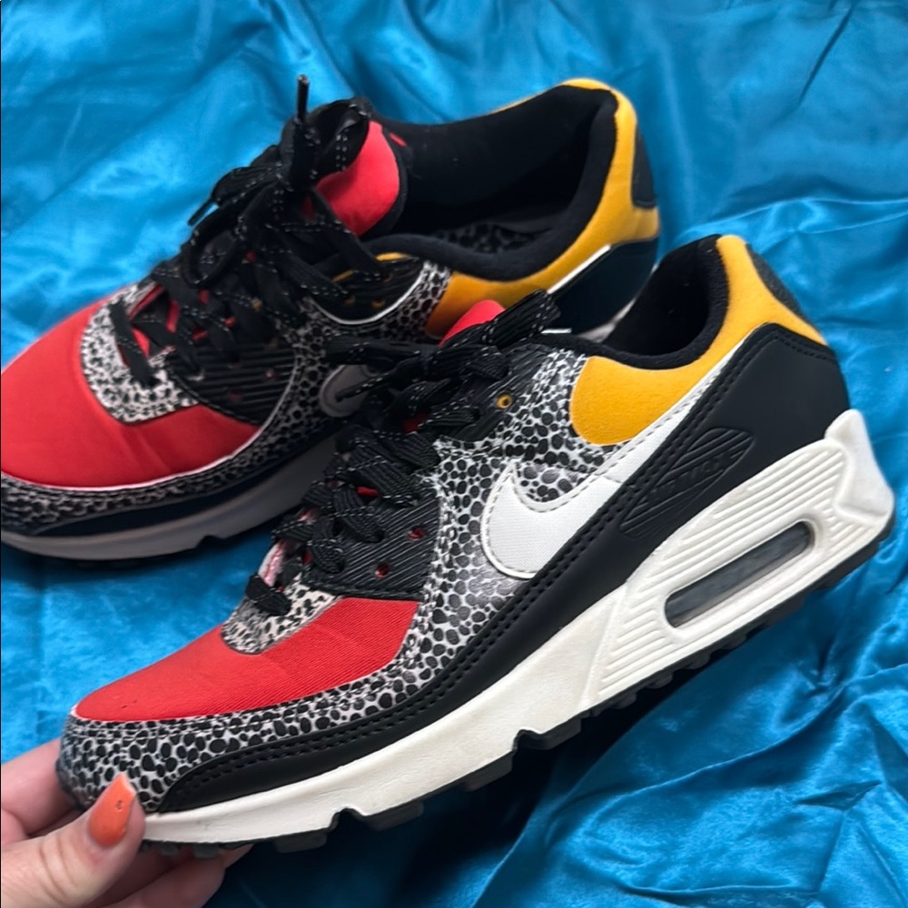 Women’s size 7.5 NIKE Red and Yellow Sneakers with Animal Print